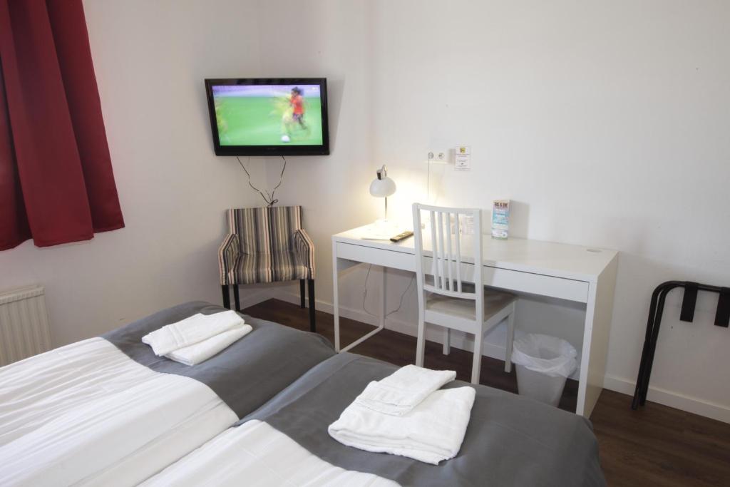 Postel nebo postele na pokoji v ubytování Rasta Mariestad
