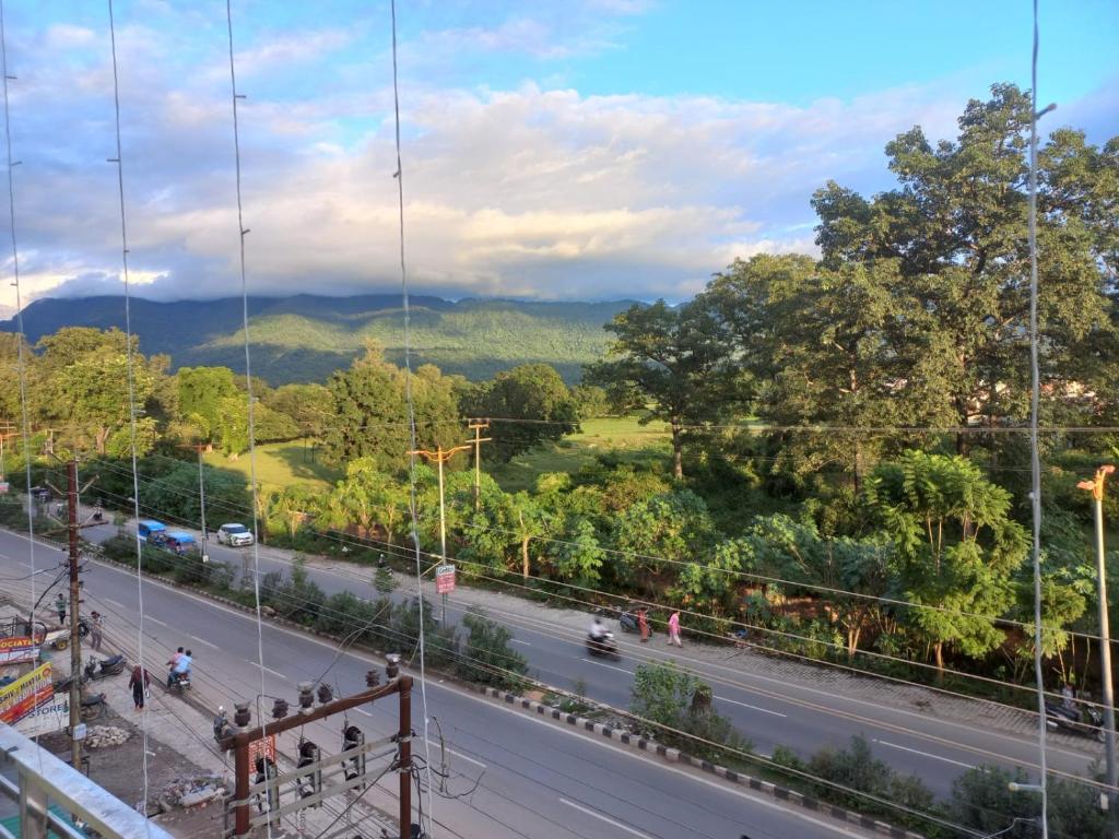 a view of a street and a road at HOTEL TIRATH in Rishīkesh