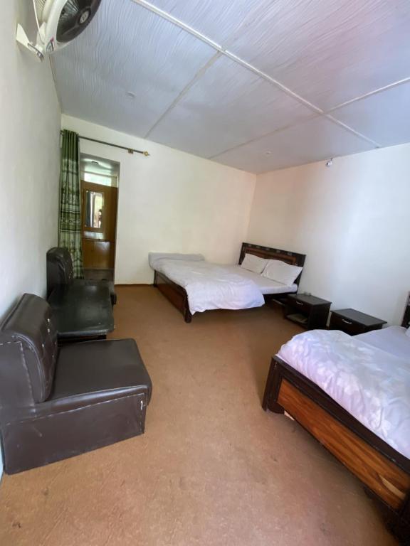 Katil atau katil-katil dalam bilik di Rainbow Resort Kachura