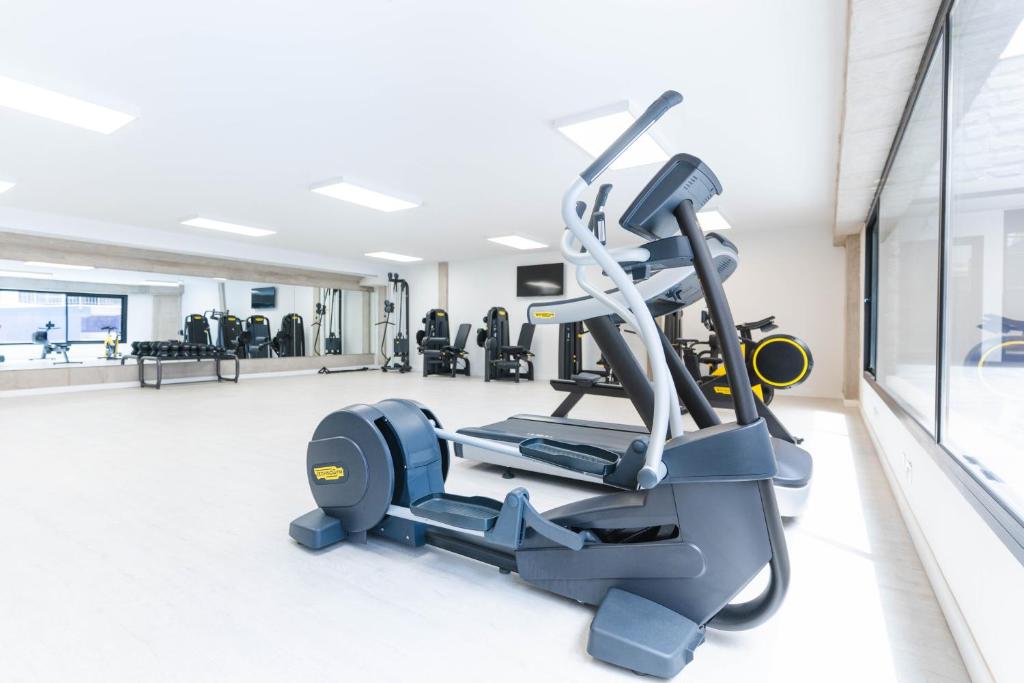 a gym with a treadmill and a elliptical machine at Esmeralda Cotillo Homes by LIVVO in El Cotillo
