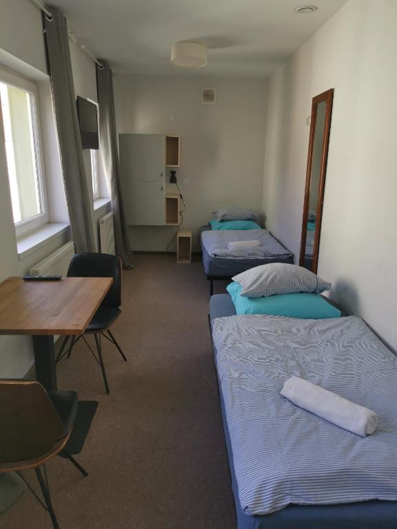 Posteľ alebo postele v izbe v ubytovaní Bemma Apart Hostel