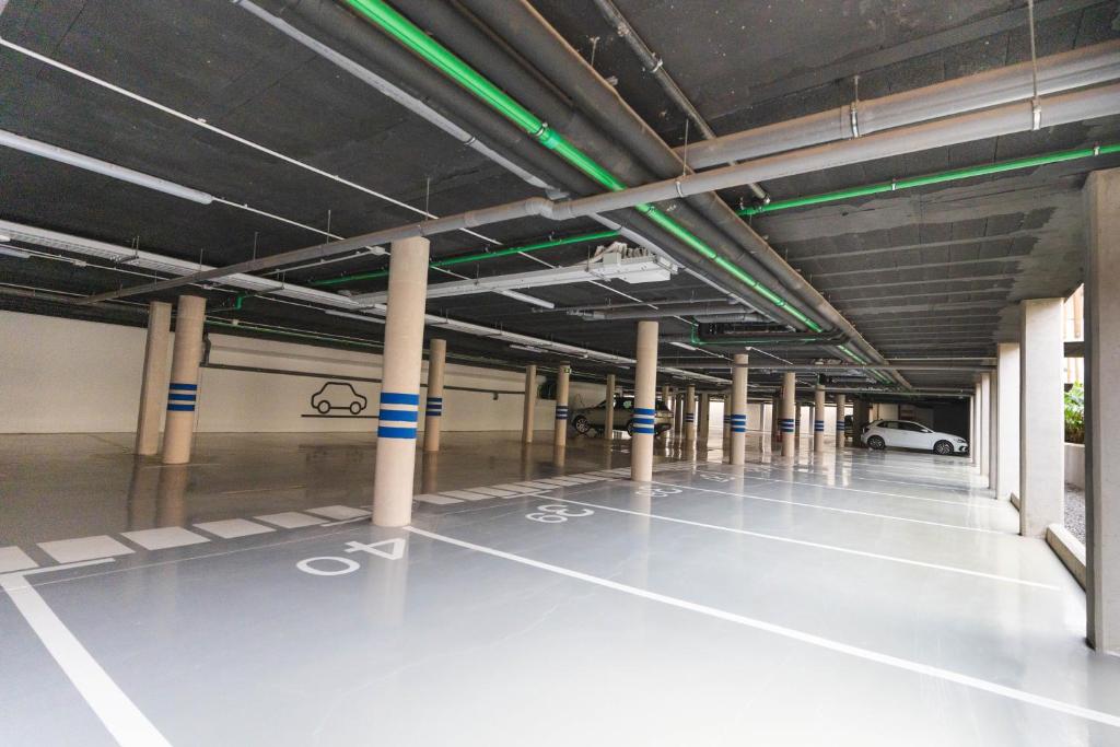 an empty parking garage with columns and a parking lot at Esmeralda Cotillo Homes by LIVVO in El Cotillo