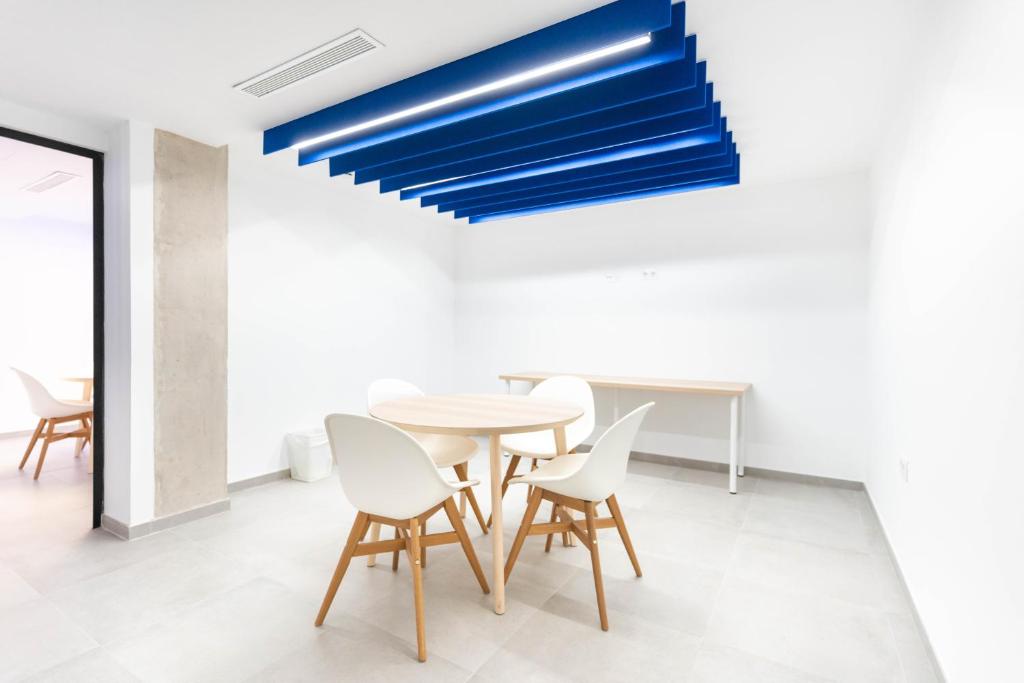 a dining room with a table and chairs at Esmeralda Cotillo Homes by LIVVO in El Cotillo