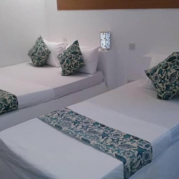 Postel nebo postele na pokoji v ubytování Varadero Zanzibar Hotel