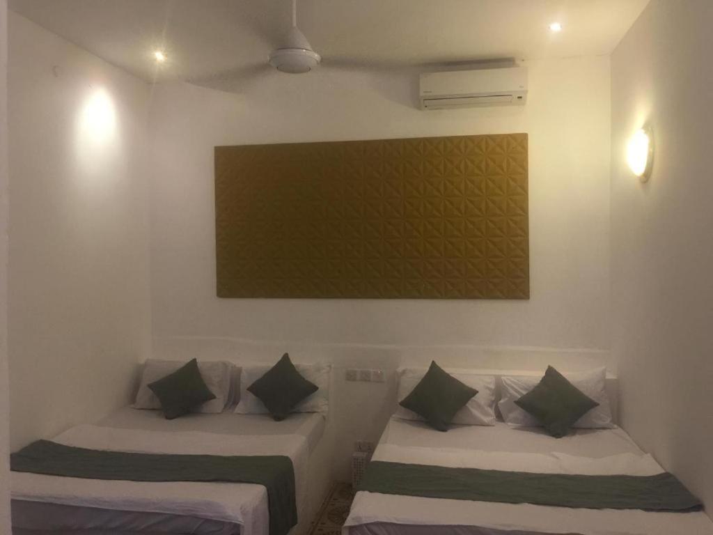 Postel nebo postele na pokoji v ubytování Varadero Zanzibar Hotel