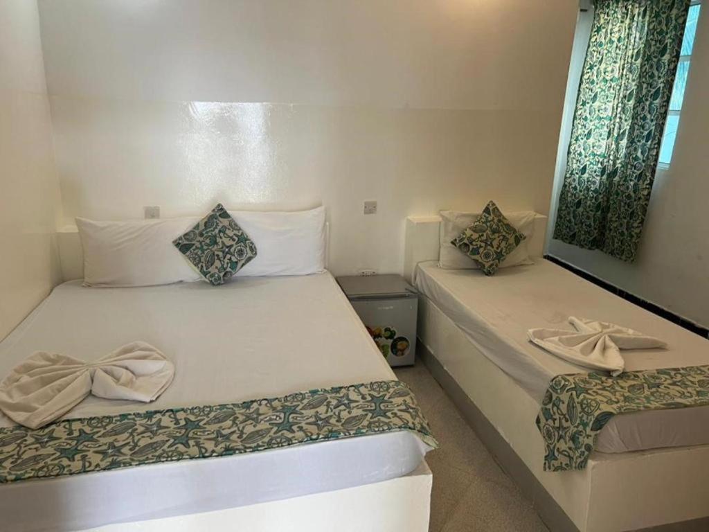 Postel nebo postele na pokoji v ubytování Varadero Zanzibar Hotel