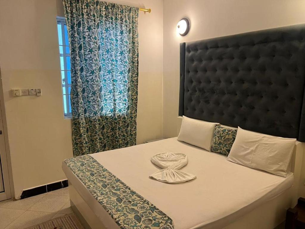 Postel nebo postele na pokoji v ubytování Varadero Zanzibar Hotel