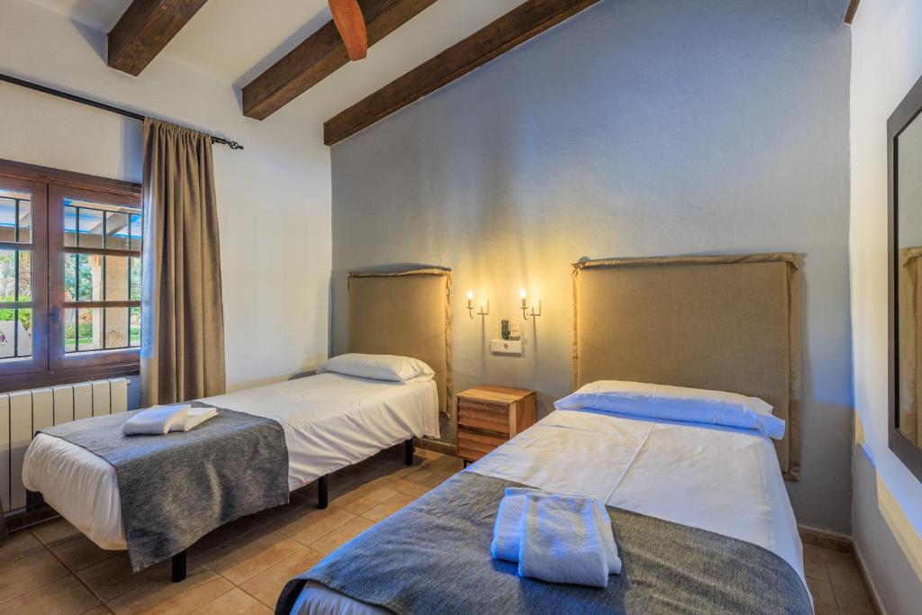 Postel nebo postele na pokoji v ubytování Villa Benvingut by Sealand Villas
