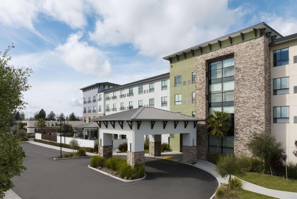 an exterior view of a hotel with a gazebo at Hotel Centro Sonoma Wine Country, Tapestry Collection Hilton in Rohnert Park