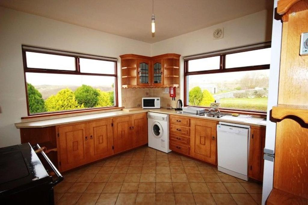 Kuchyň nebo kuchyňský kout v ubytování Pooreen House