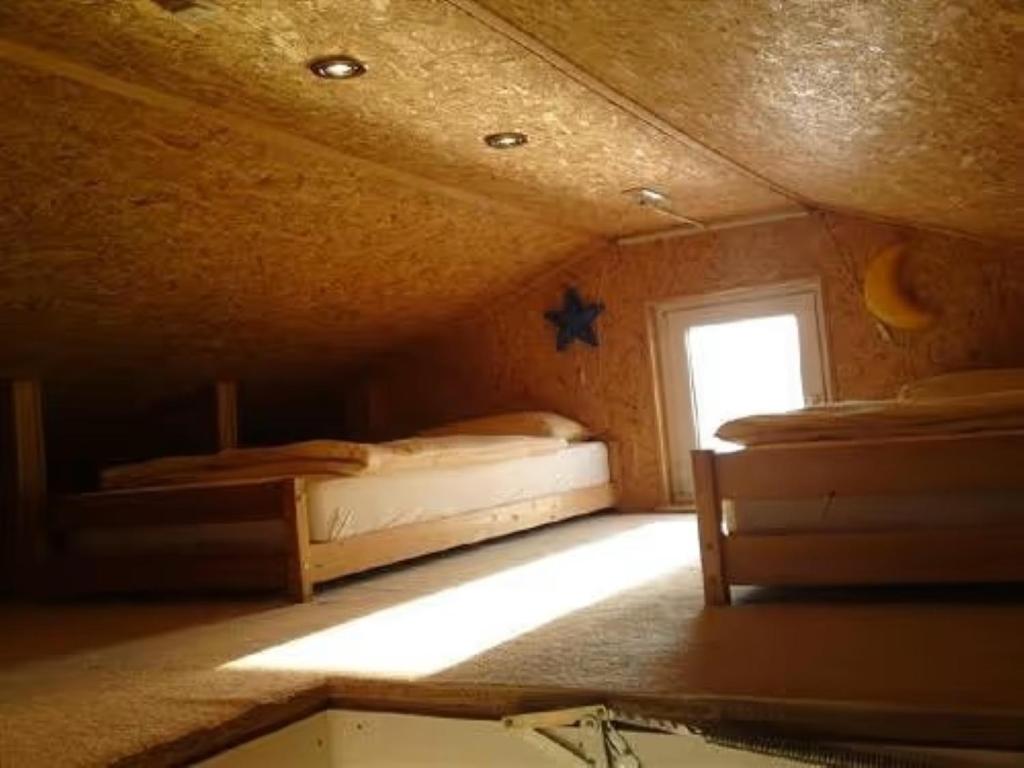 Ένα ή περισσότερα κρεβάτια σε δωμάτιο στο Haus 'am Selliner See-wismar'