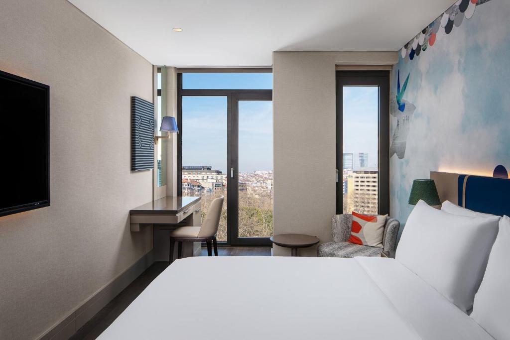 Postel nebo postele na pokoji v ubytování Lokalist, Istanbul, a Tribute Portfolio Hotel
