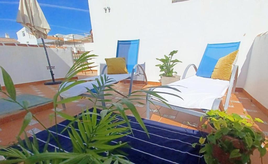 フリヒリアナにあるTipica Casa En Frigiliana con patio y terrazaのベッド付きの部屋