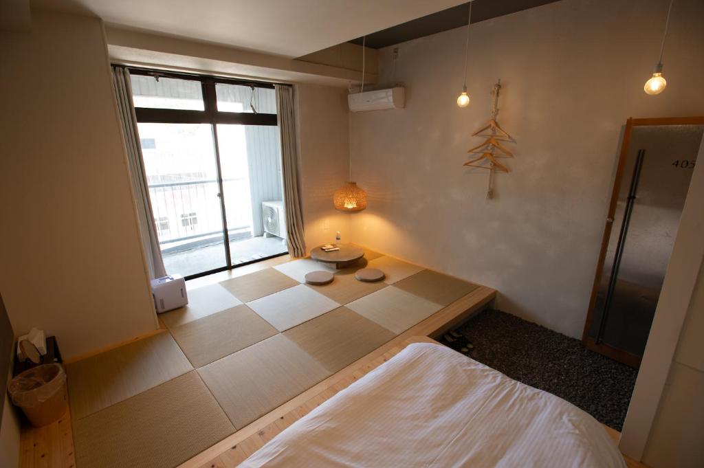 Postel nebo postele na pokoji v ubytování ホステル Cabin