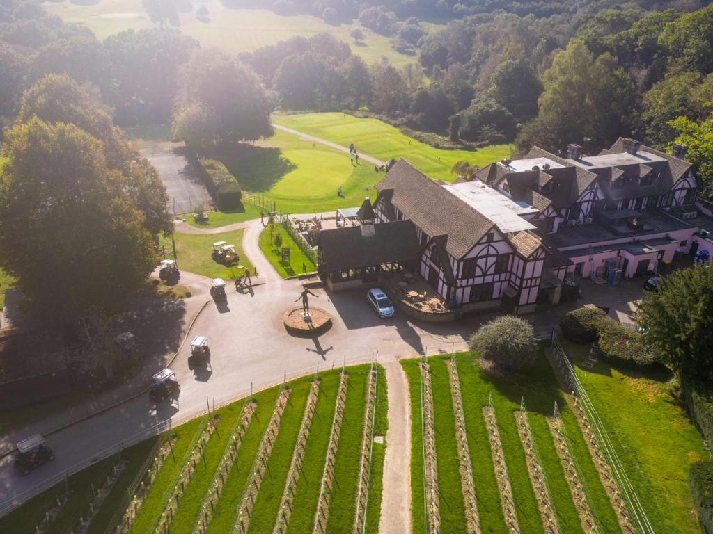 an aerial view of a large house with a courtyard at The Vineyard Hotel in Horsham