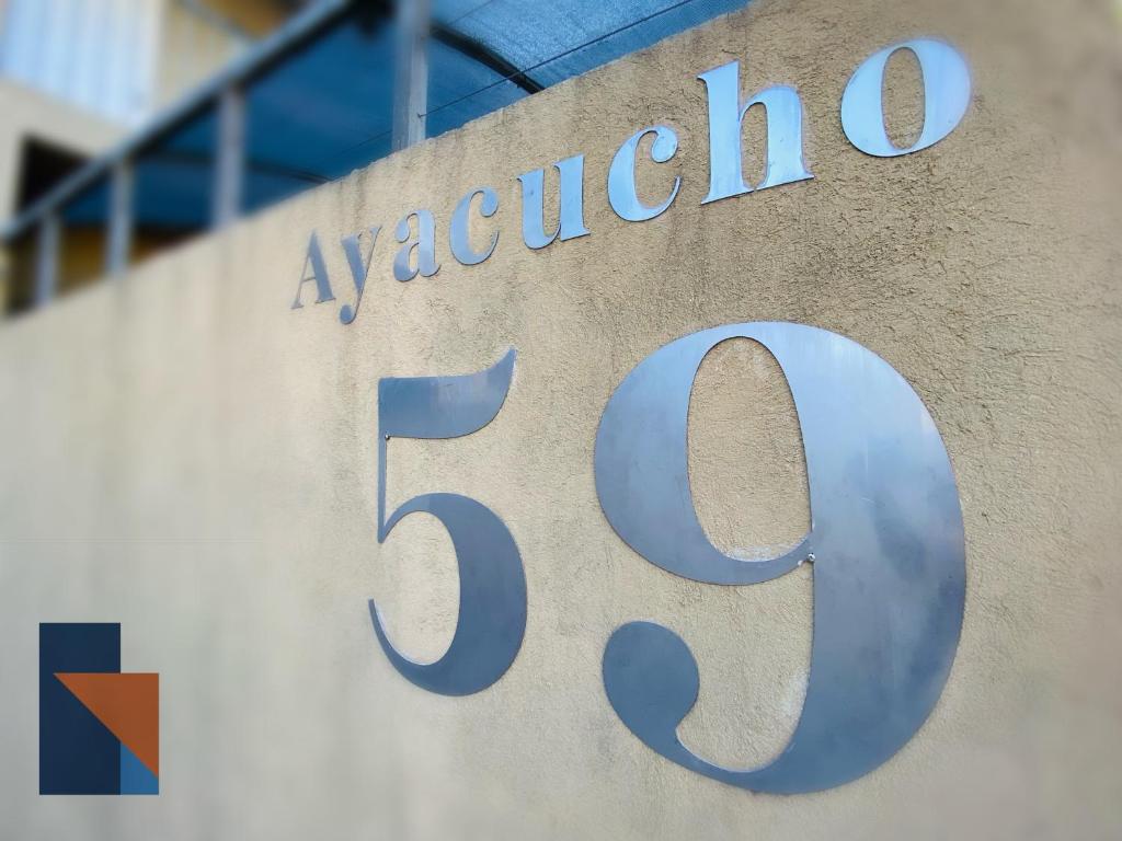 aania sign on the side of a building at Ayacucho 59 in Venado Tuerto