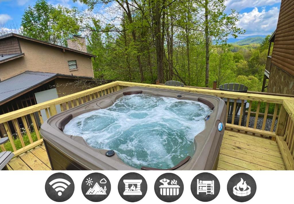 a hot tub on the deck of a house at Dolly's Lodge # 3 condo in Sevierville