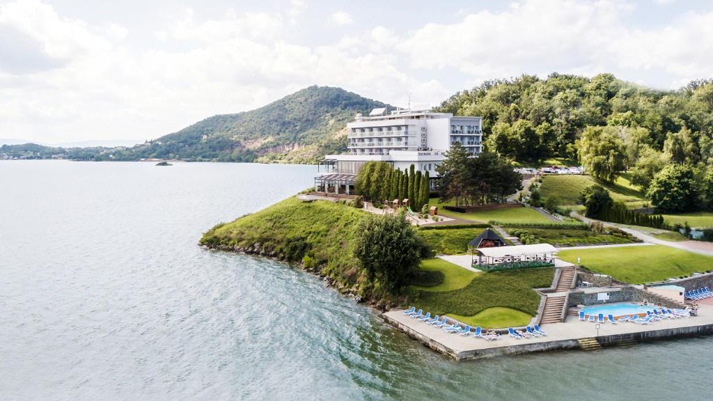 an island in the middle of a body of water at Hotel Eurobus in Kaluža