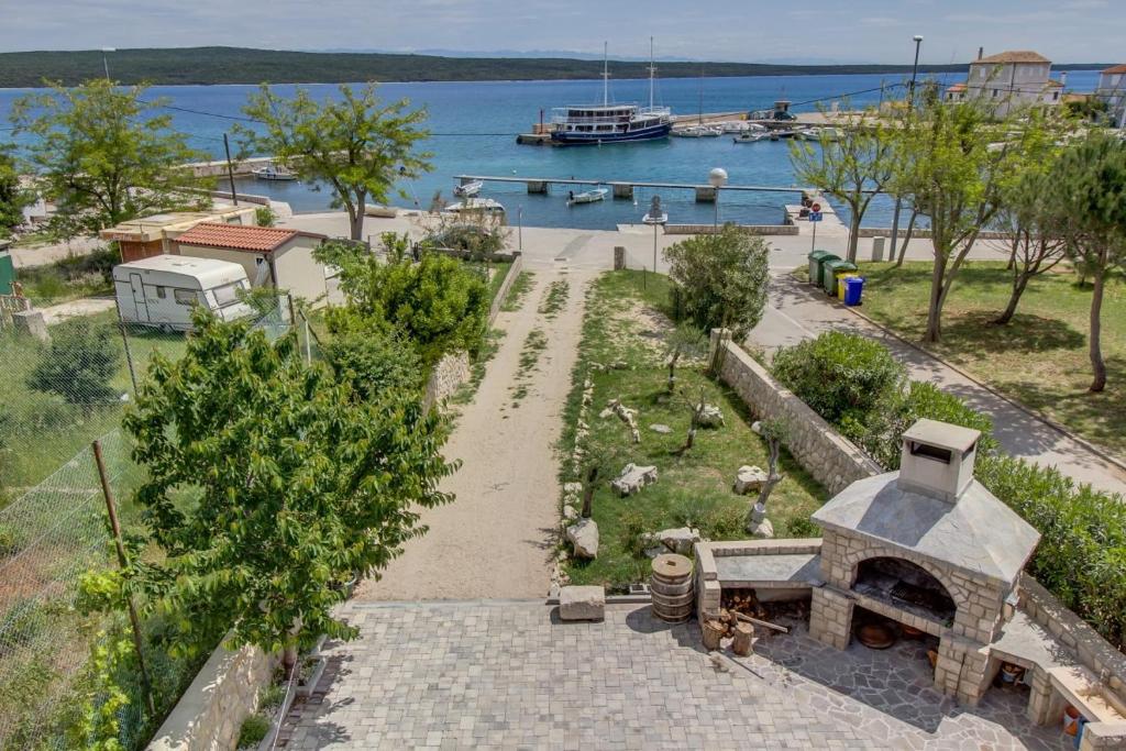an aerial view of a garden with a pizza oven at House MARISSA by the sea with sea view in Nerezine