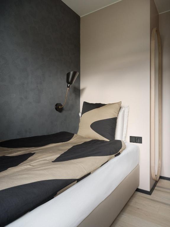 Letto o letti in una camera di Hotel Lotus