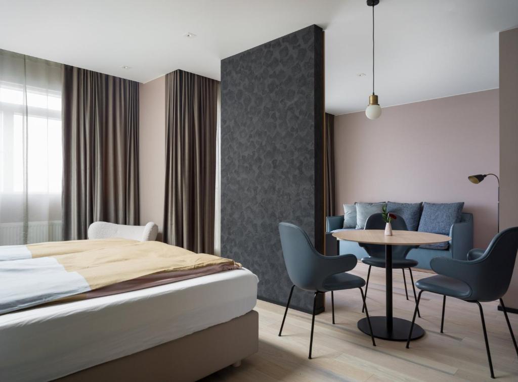 Letto o letti in una camera di Hotel Lotus