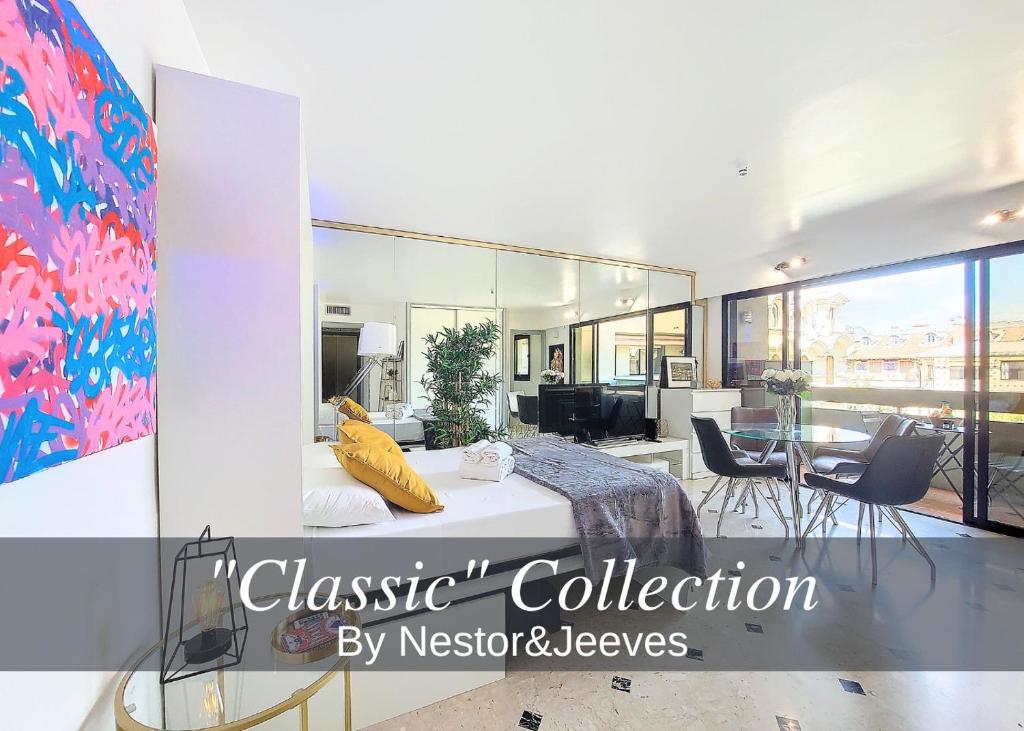 une chambre avec un lit et une salle à manger dans l'établissement Nestor&Jeeves - POP ART - central - balcony, à Nice