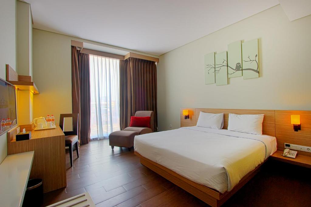 En eller flere senger på et rom på De'Rain Hotel Bandung