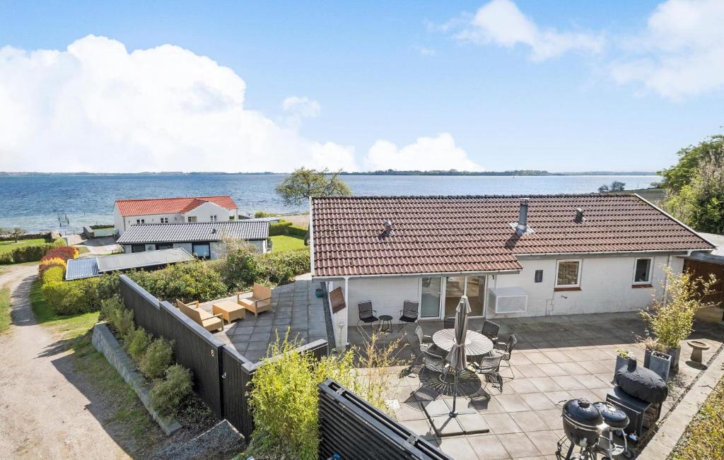 an aerial view of a house with a patio at Amazing Home In Grsten With House Sea View in Gråsten