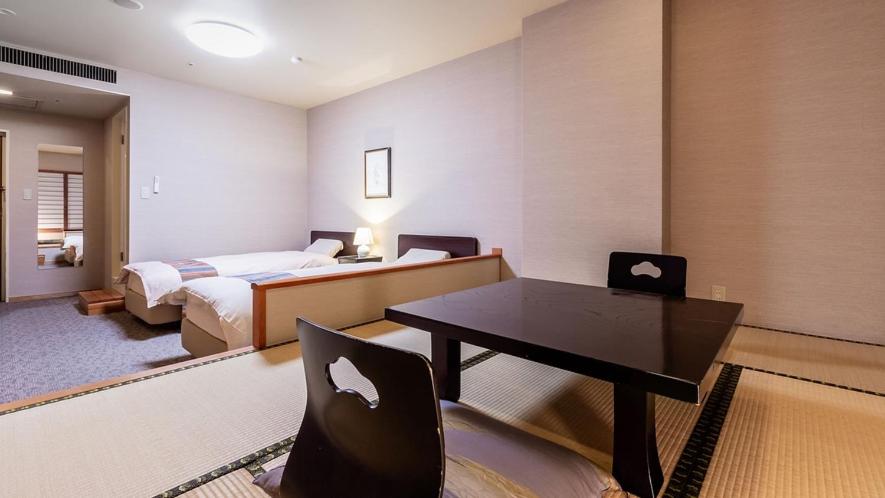 Postel nebo postele na pokoji v ubytování U-BELL Hotel Matsumasa