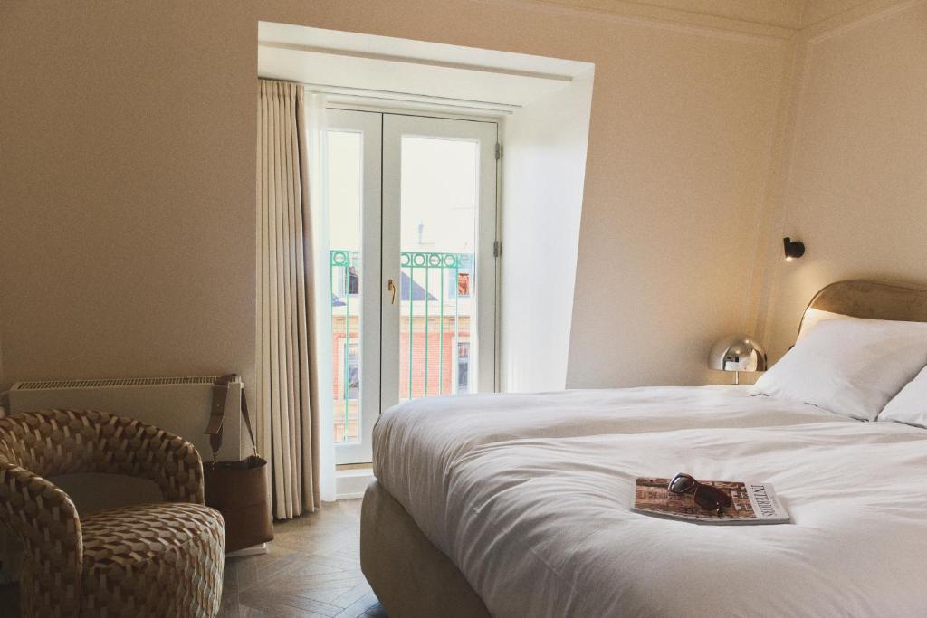 Postel nebo postele na pokoji v ubytování Hotel Bella Grande