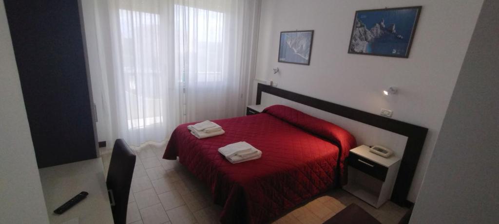 Postel nebo postele na pokoji v ubytování Hotel K2