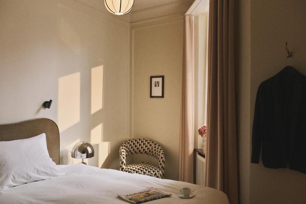 Postel nebo postele na pokoji v ubytování Hotel Bella Grande