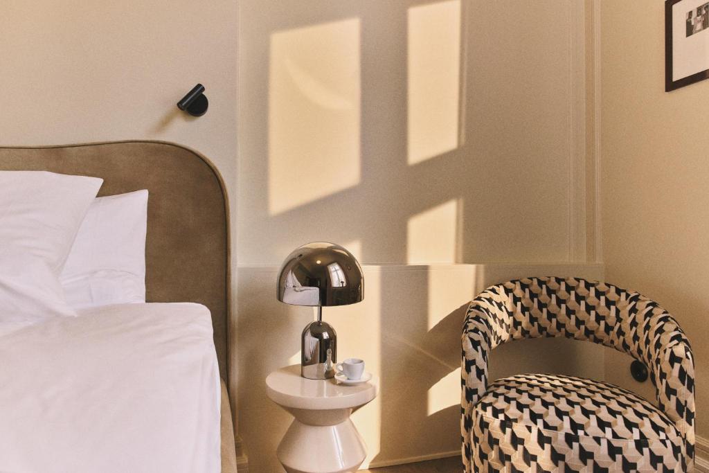 Postel nebo postele na pokoji v ubytování Hotel Bella Grande