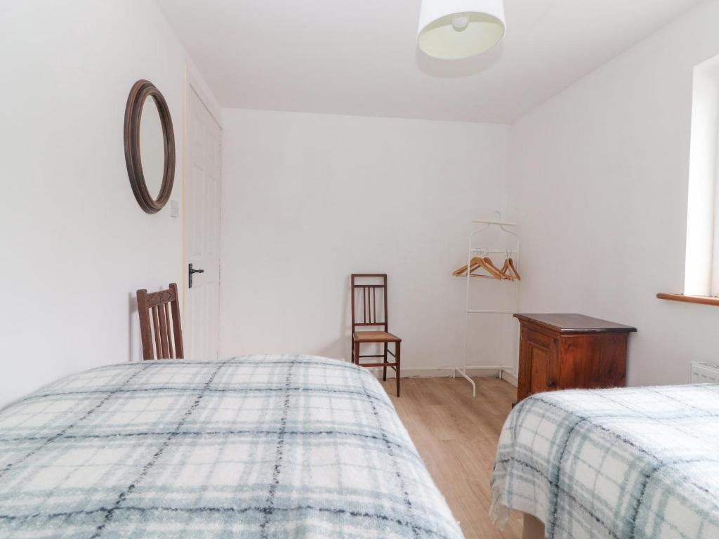 Postel nebo postele na pokoji v ubytování White Cottage
