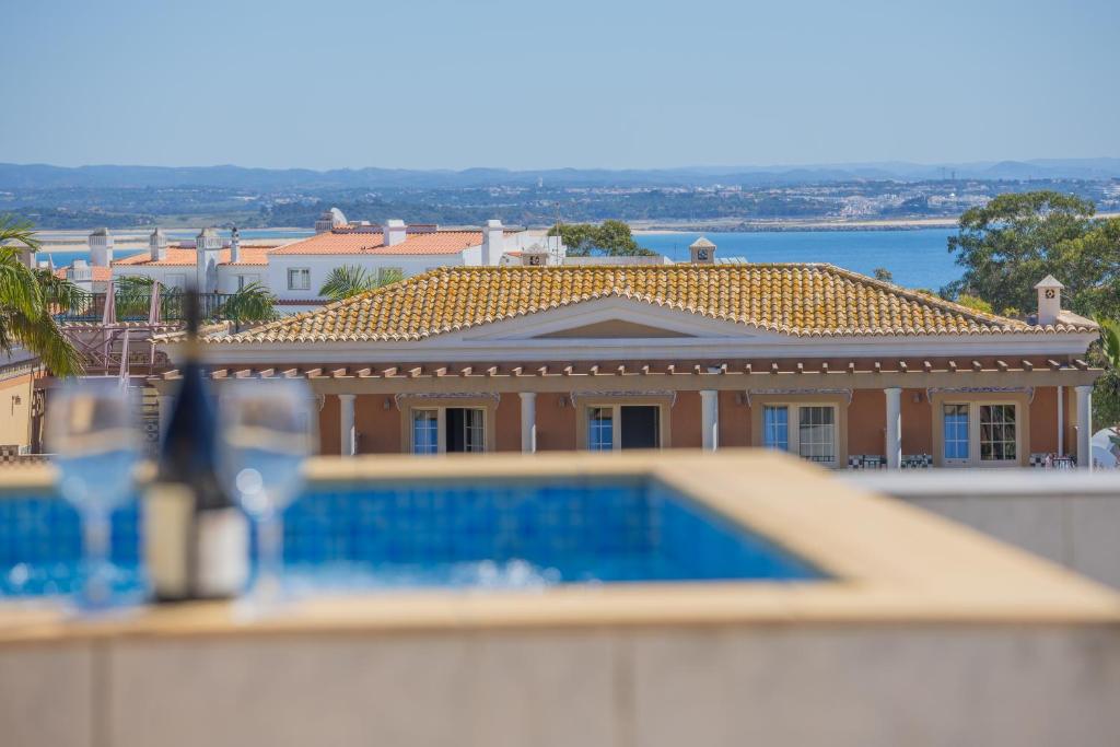 a view of a house with a swimming pool at BB Dona Ana in Lagos