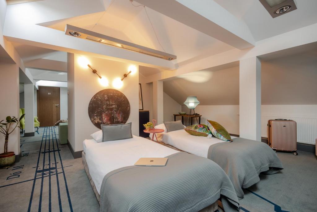 Postel nebo postele na pokoji v ubytování Hotel Beethoven