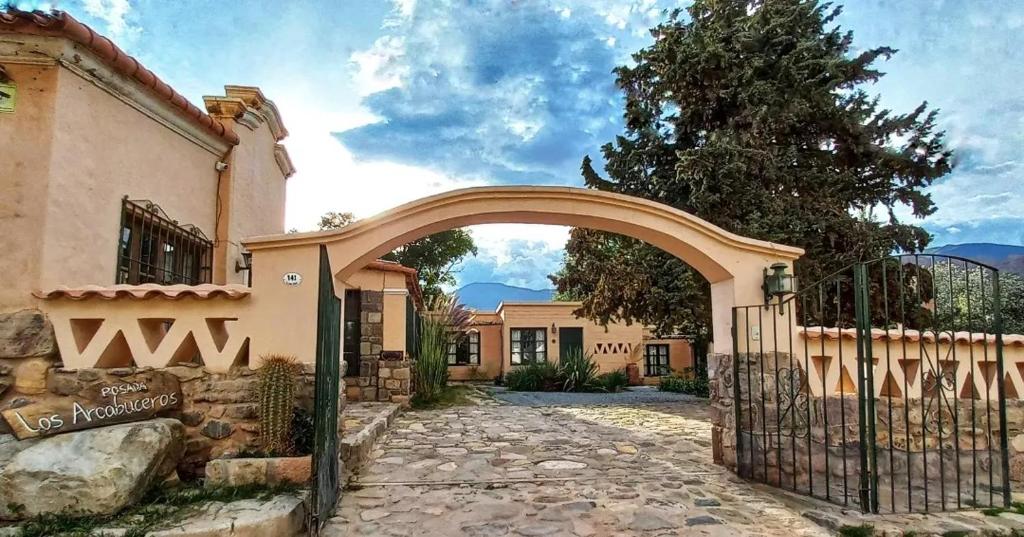 an entrance to a house with an archway at Los Arcabuceros Posada Boutique in Tilcara