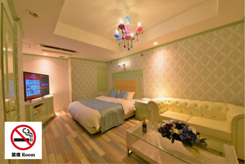 Postel nebo postele na pokoji v ubytování Hotel Vanilla Komaki (Adult Only)