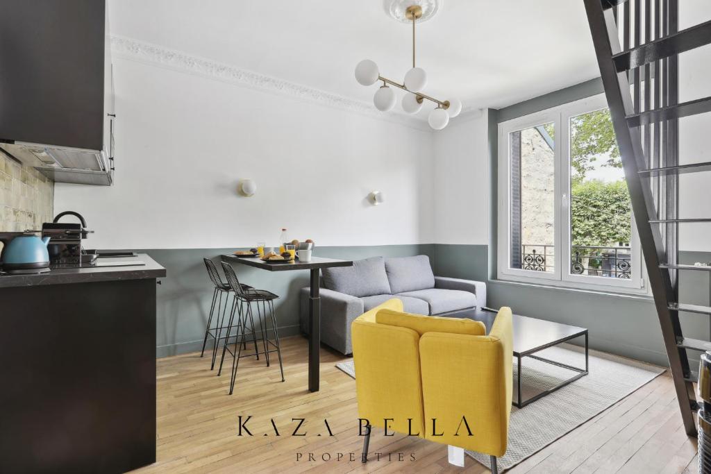 a kitchen and living room with yellow chairs and a table at KAZA BELLA - Maisons Alfort 3 Modern flat in Maisons-Alfort