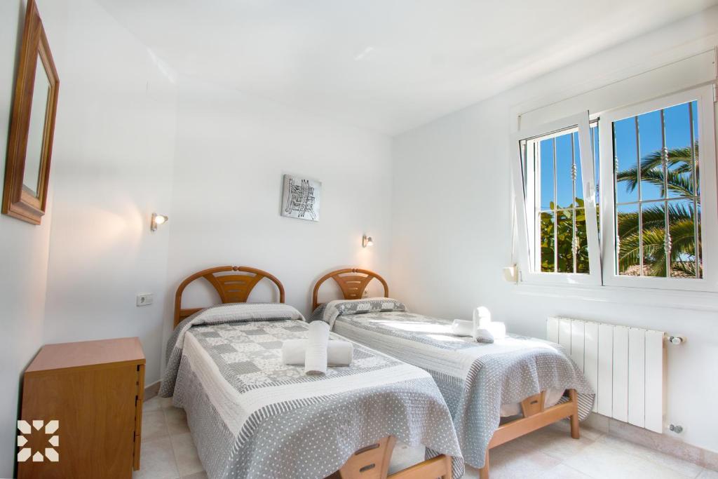 A bed or beds in a room at Villa Soleada by Abahana Villas