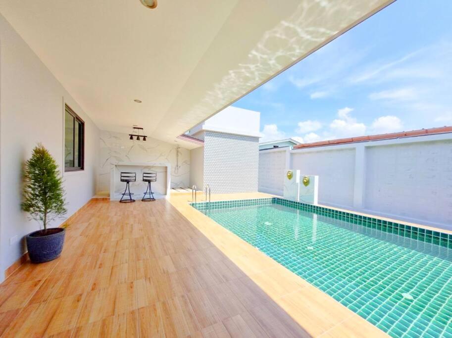 a swimming pool in the middle of a house at Pool Villa Rawai in Ban Saiyuan (1)