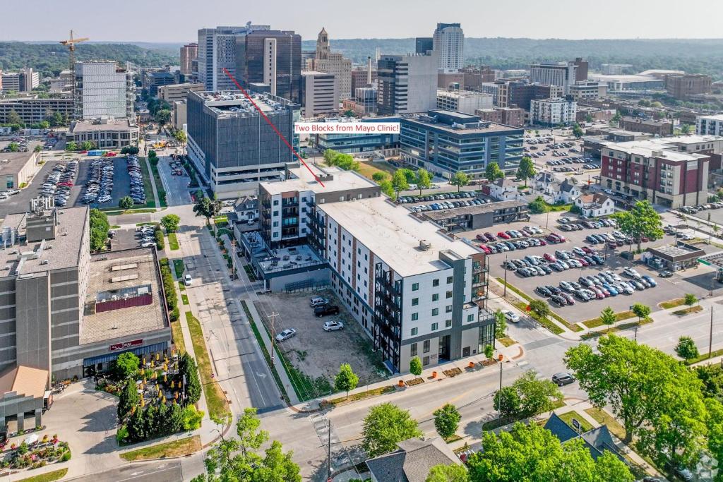 an aerial view of a city with a parking lot at 2 Bedroom 2 Bathroom New Apartment Close To Mayo! in Rochester