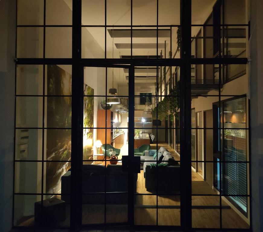 a view of a living room through a window at Residences Florale à Thionville - Coliving - Studios - Appartements in Thionville