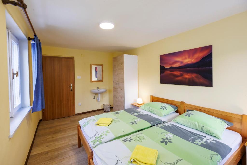 Postel nebo postele na pokoji v ubytování House Budkovič