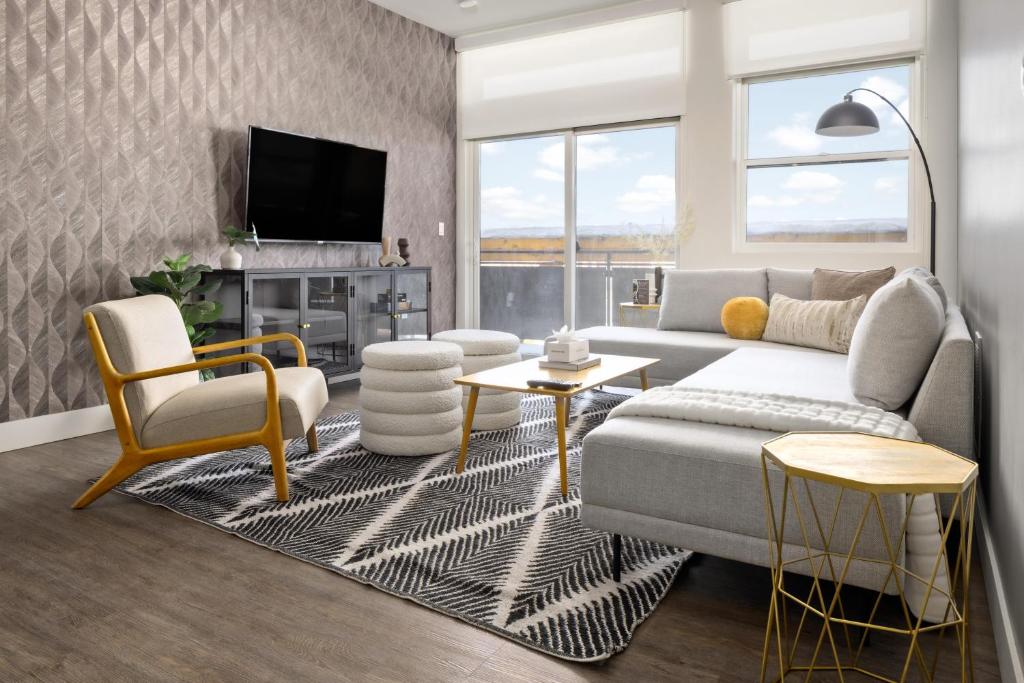 a living room with a couch and a tv at New! Sprawling Floor Plan - Central LoHi - Peloton in Denver