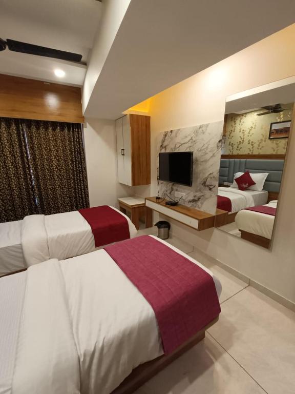 Postel nebo postele na pokoji v ubytování Hotel RK ICON