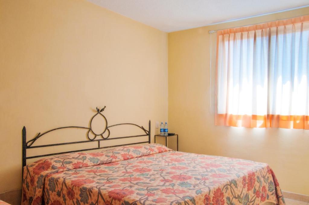 Postel nebo postele na pokoji v ubytování HOTEL XANTI