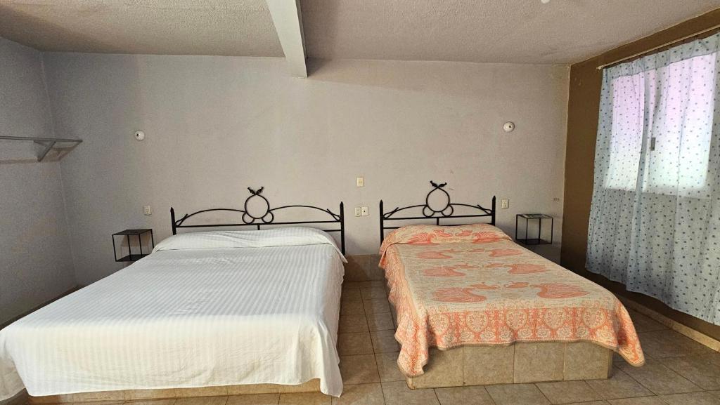 Postel nebo postele na pokoji v ubytování HOTEL XANTI