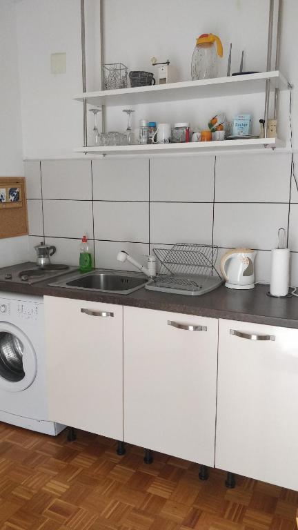 Kuchyň nebo kuchyňský kout v ubytování Apartment Lavinia