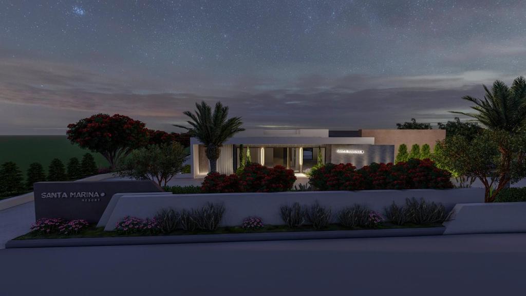 Una representación de una casa por la noche con un cielo estrellado en SANTA MARINA RESORT en Glífa